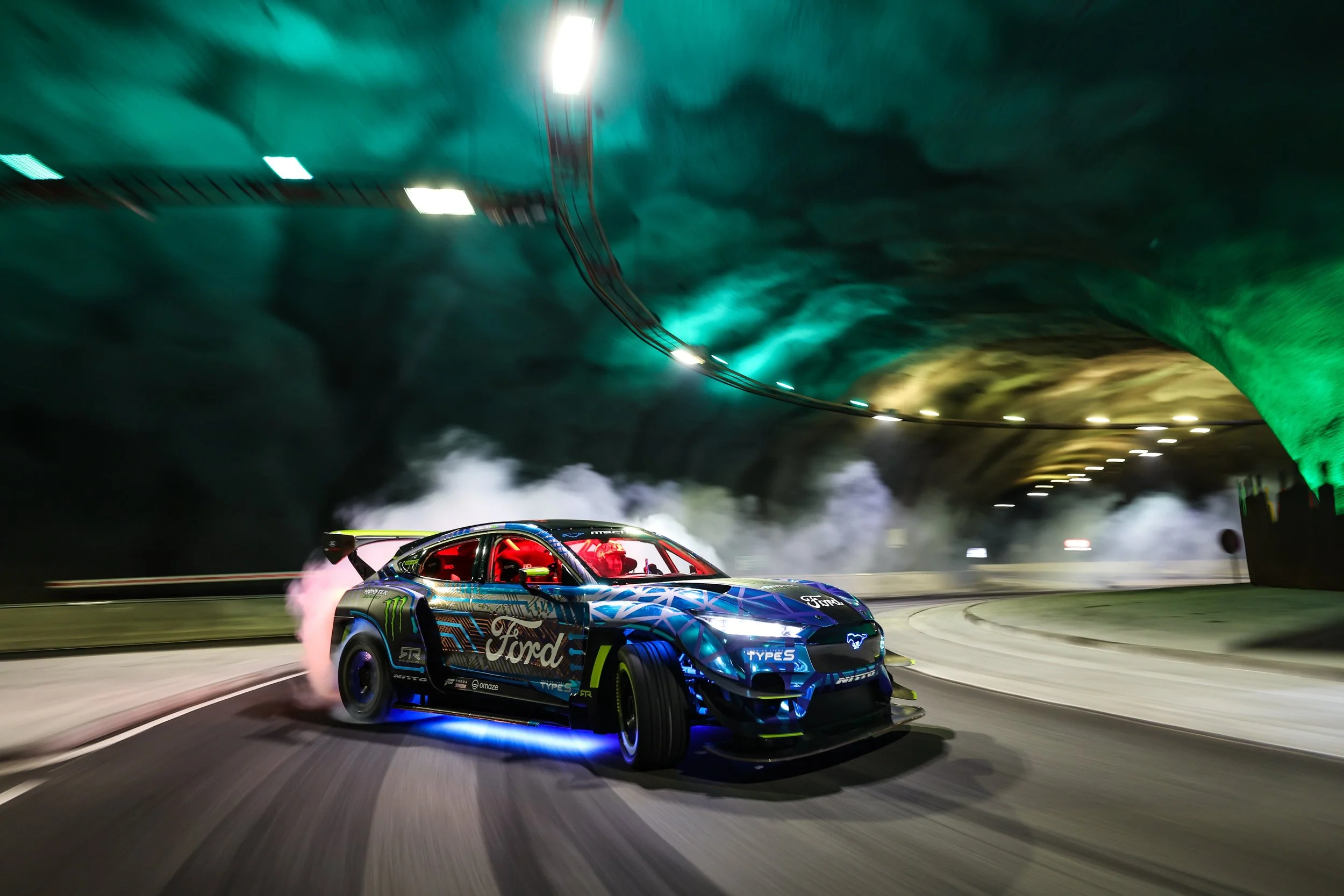 Vaughn Gittin Jr. slides into a big smoky drift inside a tunnel. Photograph by Larry Chen for the new book "Ready To Rock." Published by Carrara Media, 2026.