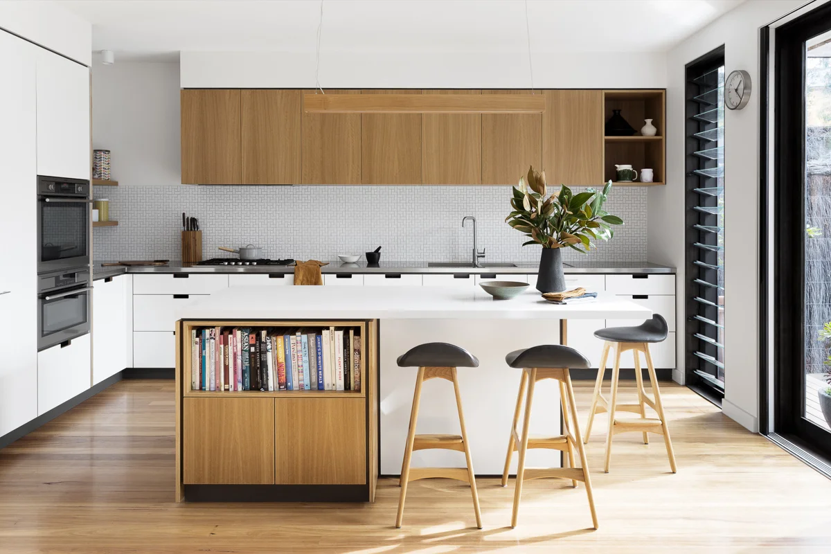Cantilever K3 Kitchen System with Stainless Steel and Stone Benchtops with Blackbutt furniture elements at Creek House
