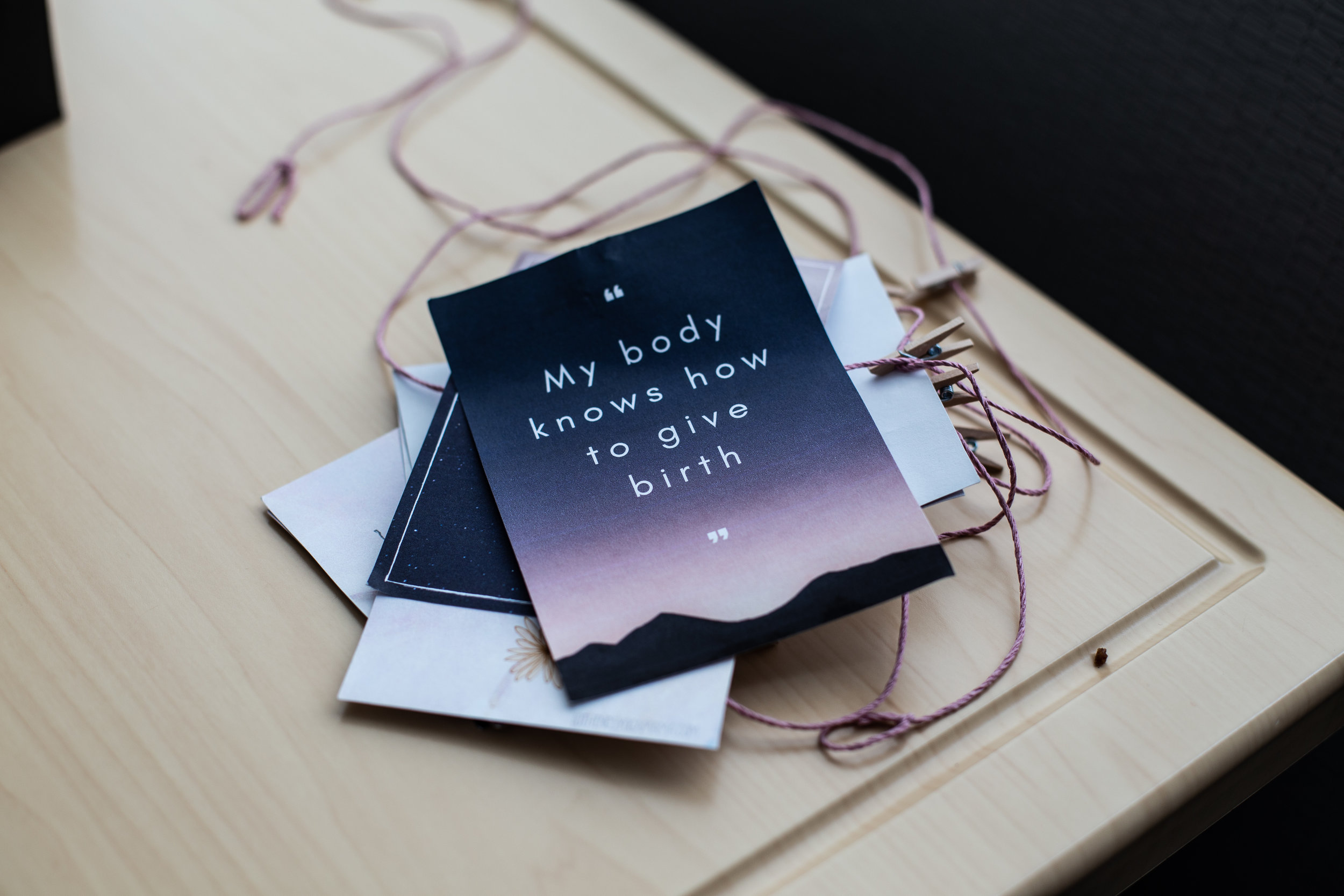 Birth affirmation cards lying on a table.