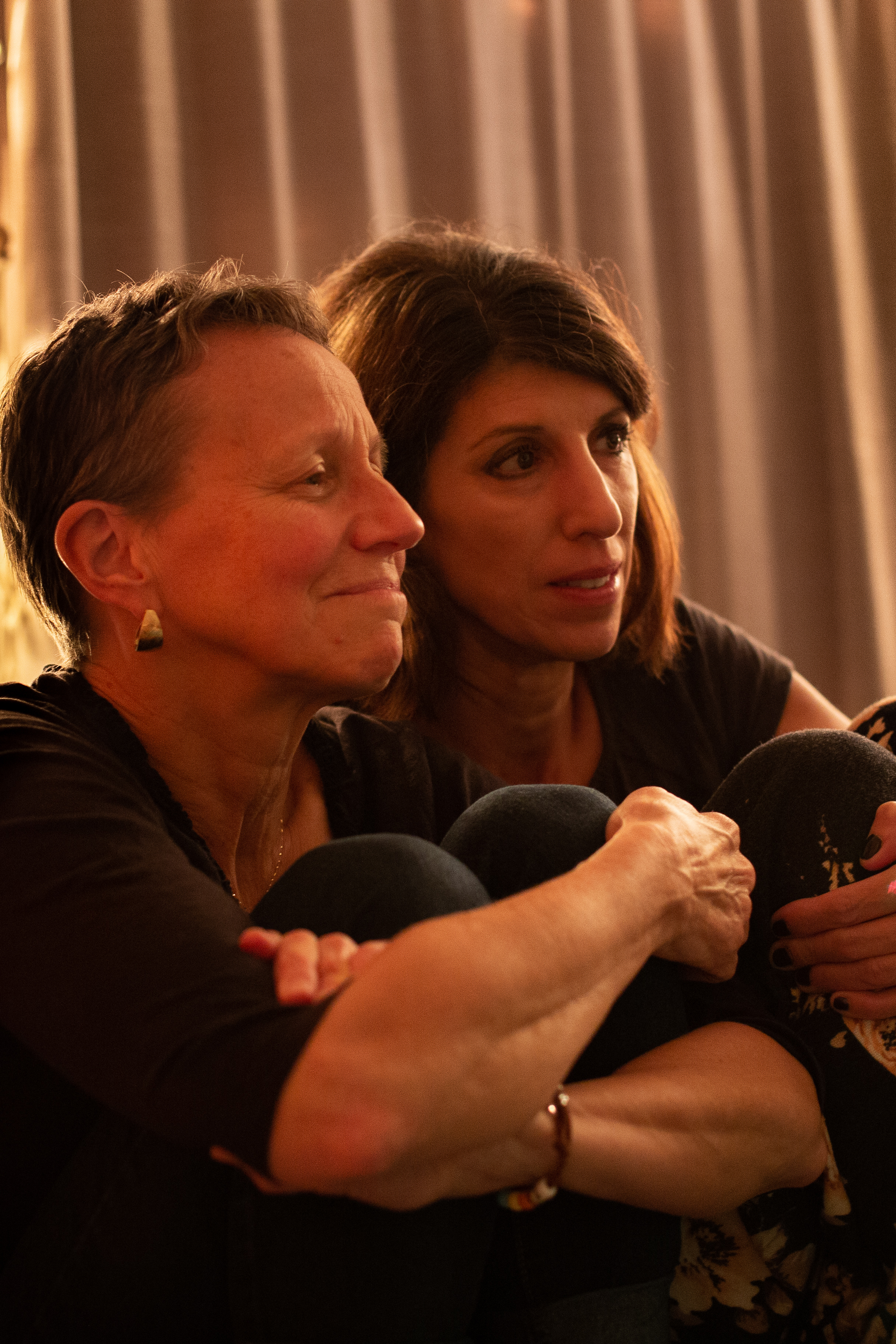 Two older women waiting to become grandmothers. 