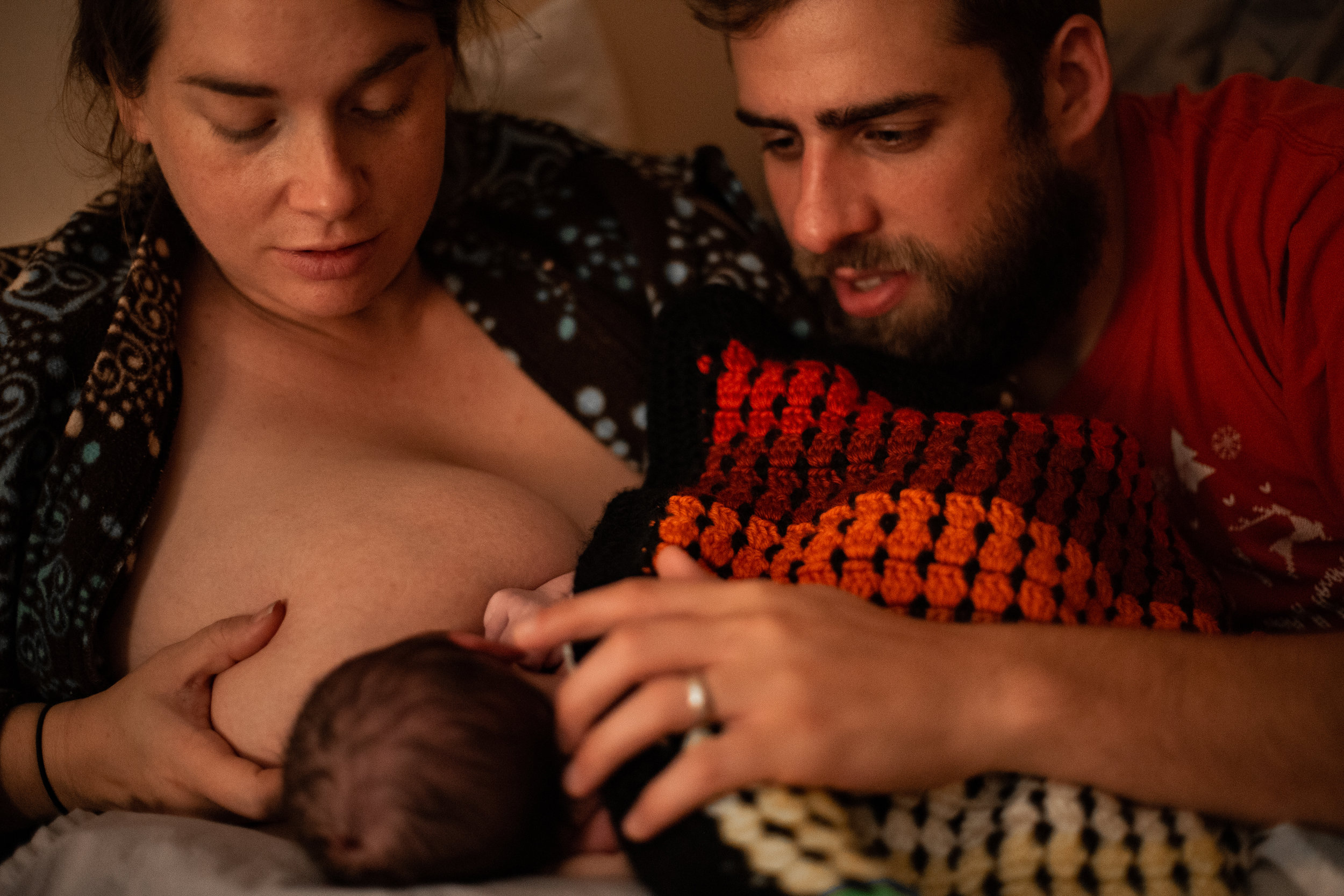 Newborn baby breastfeeds. 