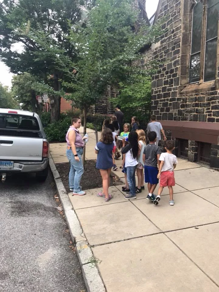 Campers inspecting tree pits.jpg