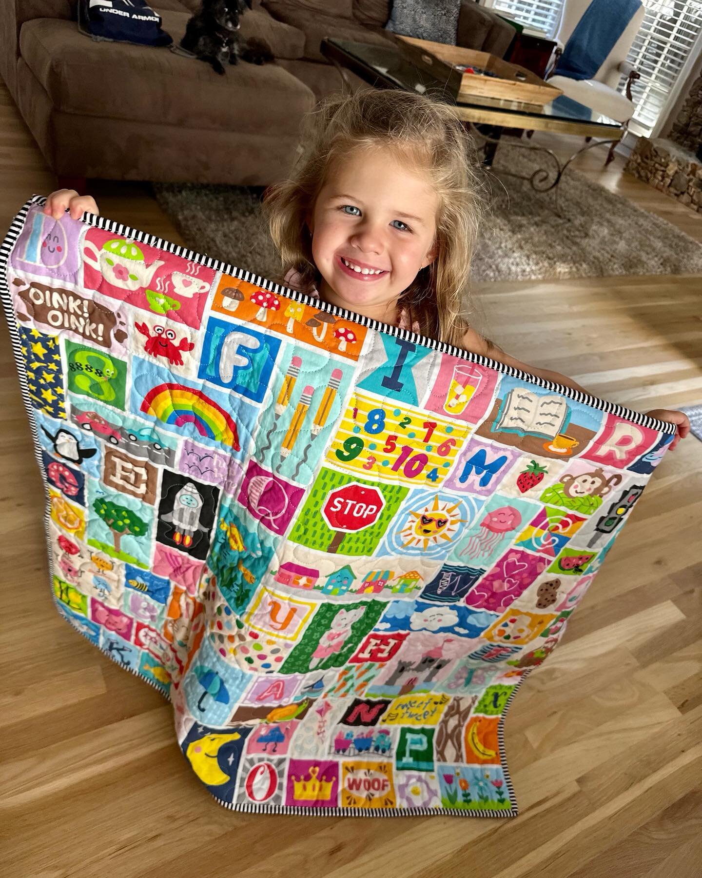 A happy recipient of an &ldquo;I Spy&rdquo; quilt! Tandem is working hard to get new quilts ready for you! Stay tuned! Updates soon about new fall markets! 🧵🪡✂️