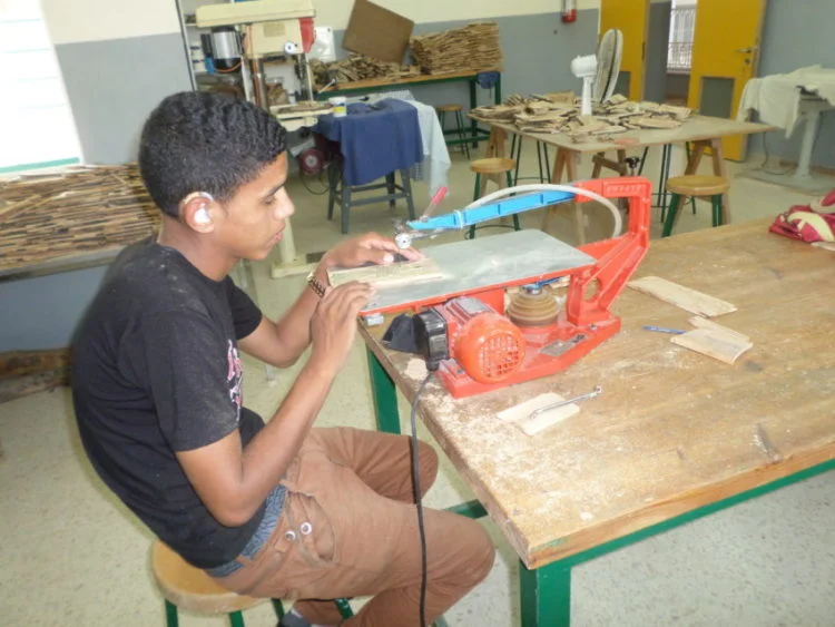 Maher is one of five children, the only one deaf. He received a hearing aid from Holy Land Institute for the Deaf (HLID) in Jordan. Image courtesy of 3dp4me.org.