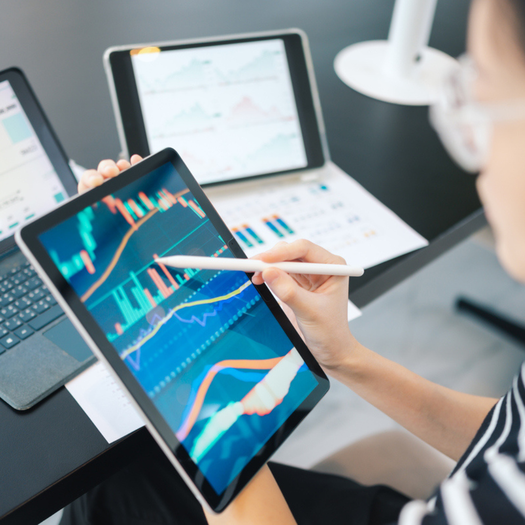 Finance person looking at a finance graph in a tablet