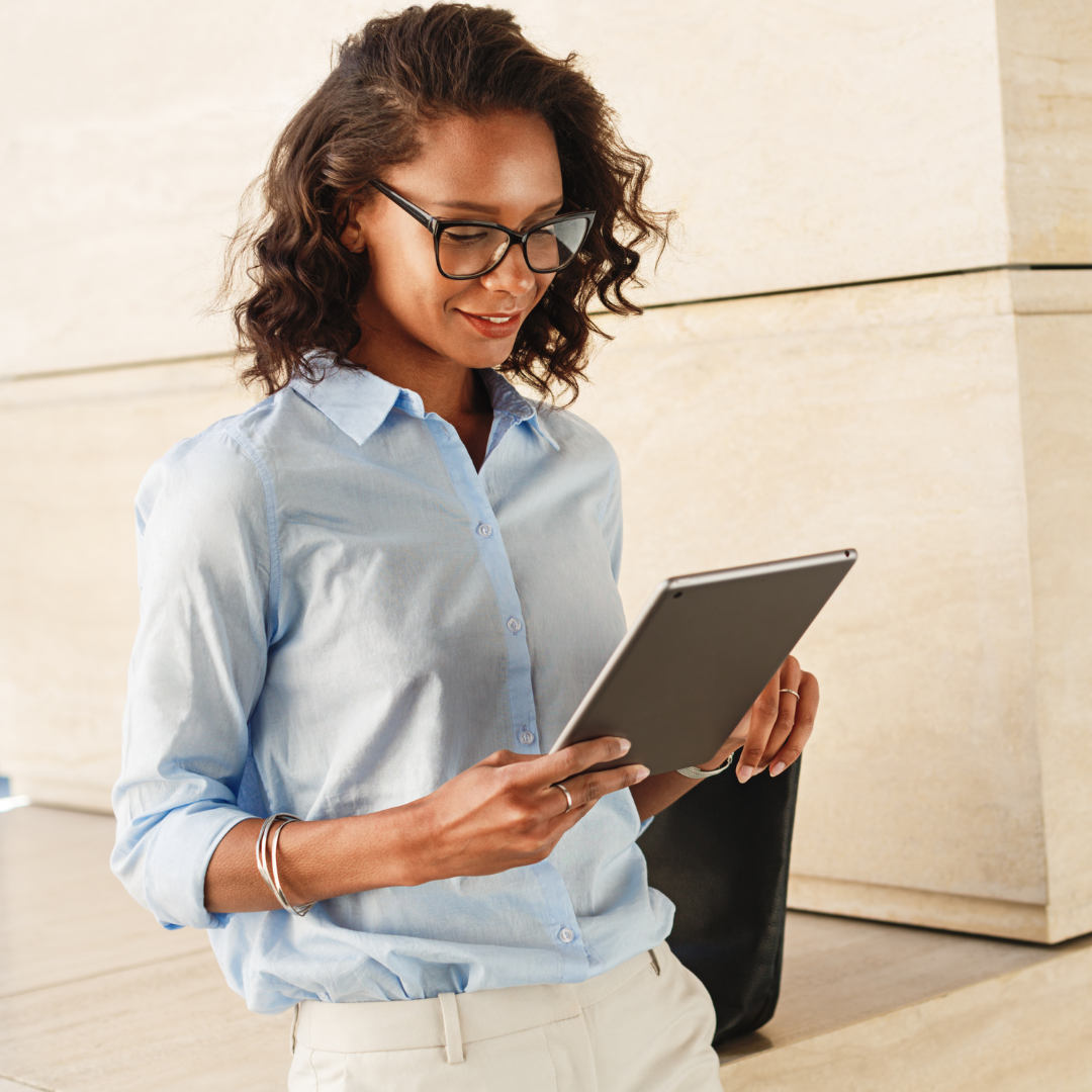 Woman holding and using a tablet