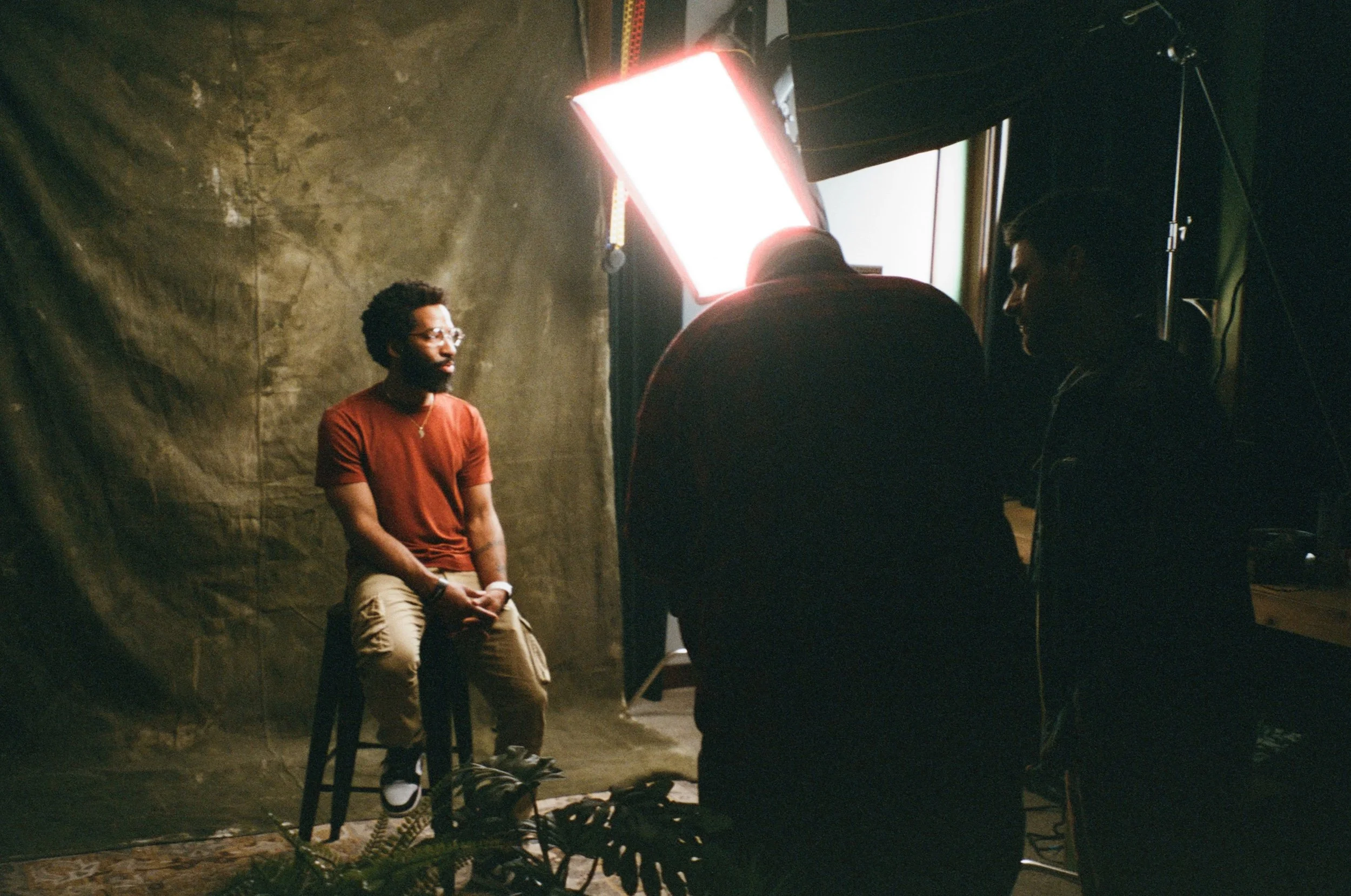 Artist Dustin Hunt scanning images captured of Lansing resident during Lansing Shaped photoshoot 
