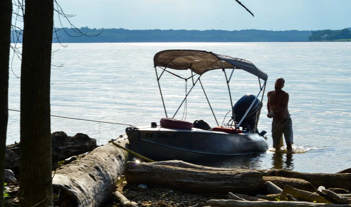 Donnelly on the shores of his beloved Potomac River, collecting driftwood and other abandoned treasures to repurpose into art pieces.