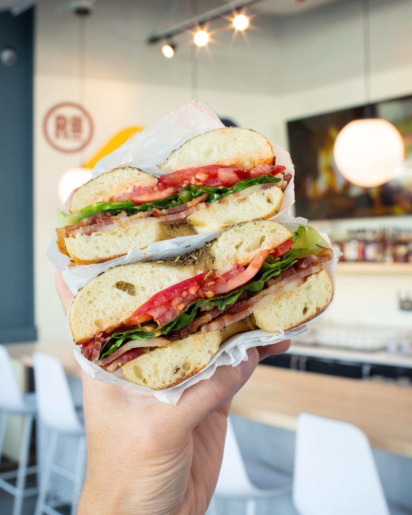 BLT but make it Bagel 🥯 These epic @rubinstein_bagels sandwiches are ready to fuel you up for a fun day in the sun. Stop by our new location in Downtown Redmond, right next to @tavolatapasta, for a breakfast or lunch sando and refreshing drink! Visi