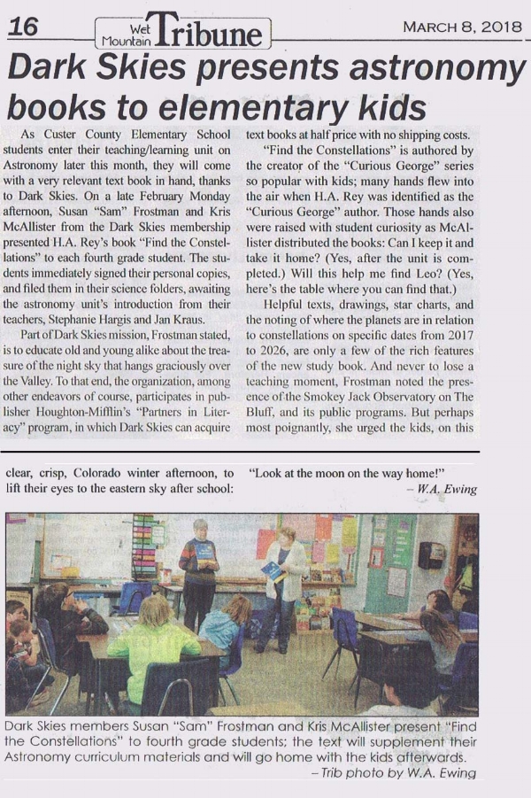 Dark Skies members Susan "Sam" Frostman and Kris McAllister present donated astronomy books to local elementary.