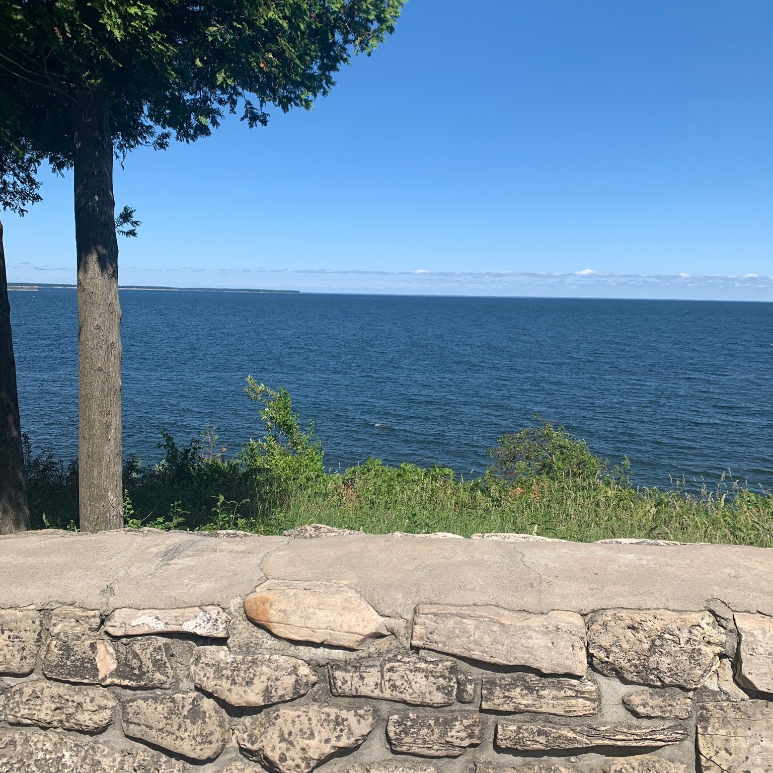 Stone walls, blue skies, and endless water views &mdash; just one of the many calming moments Door County has to offer. Whether you're here to relax, explore, or secretly plan your next home project (we see you snapping pictures of trim details 😄), 