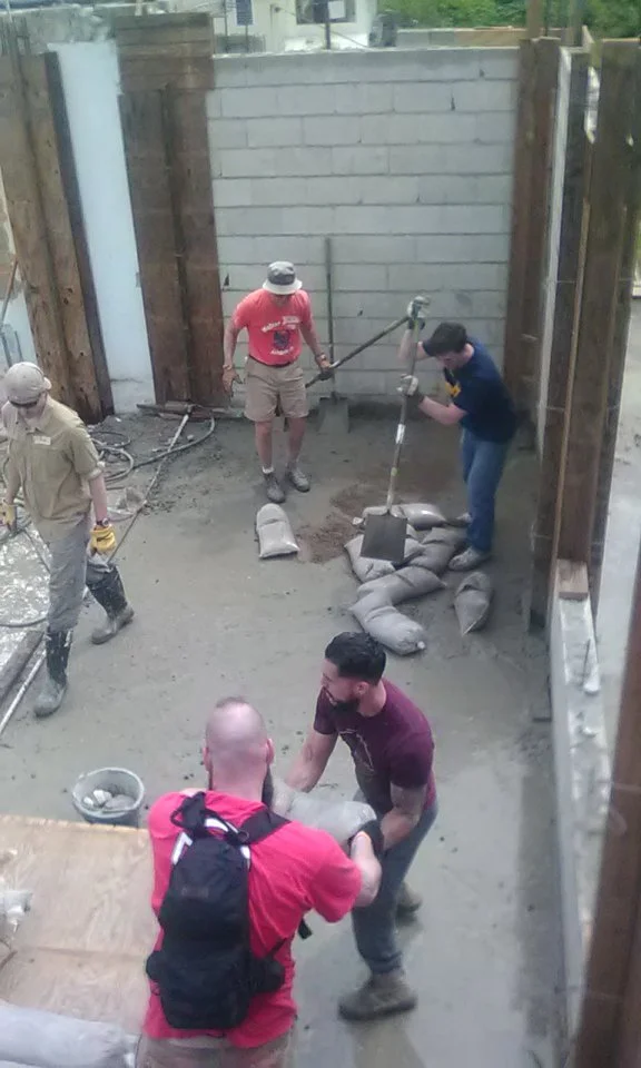 Mixing concrete for joints at a church in Puerto Rico
