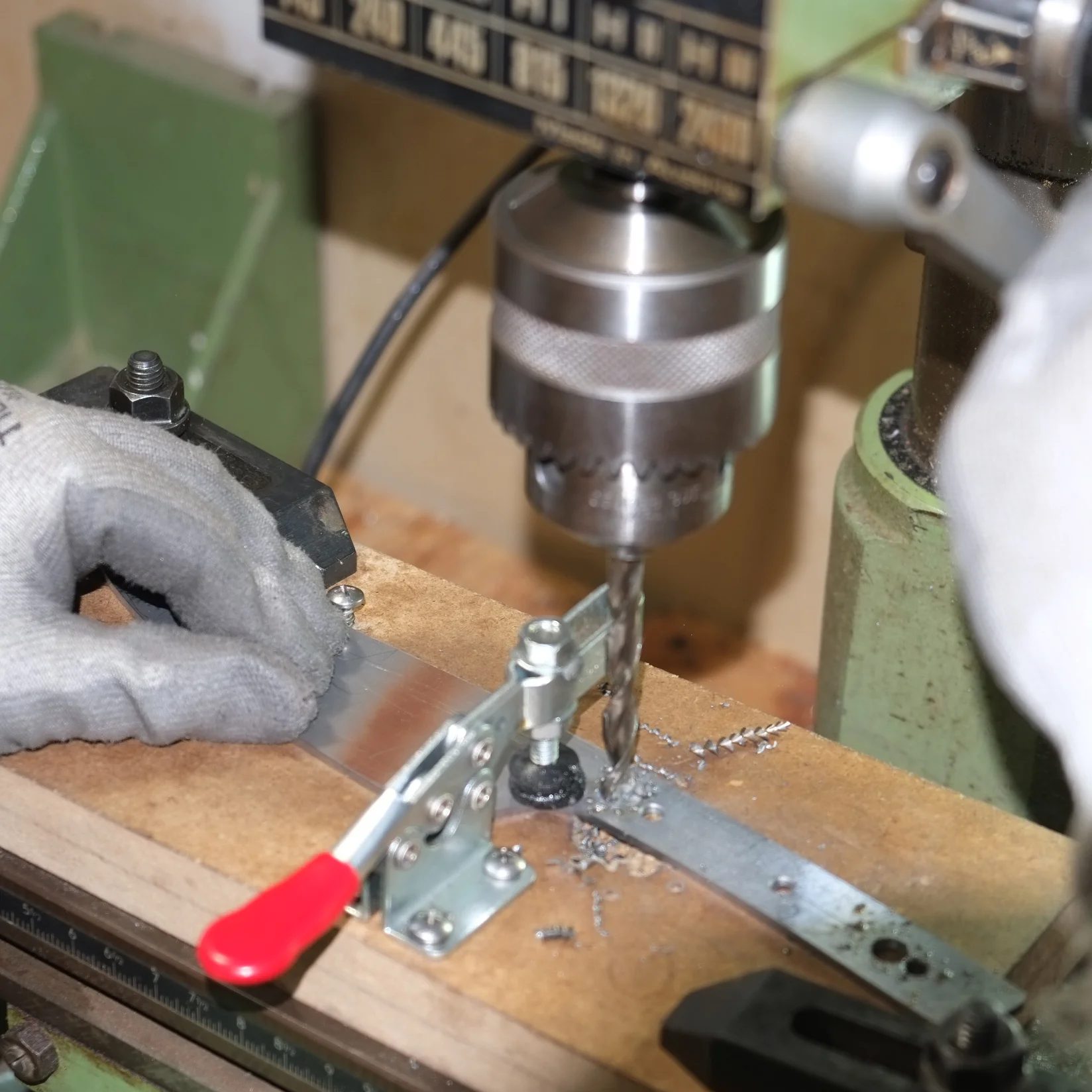 Holes are located and drilled on the handle both for the eventual placement of pins and to reduce the handle weight and balance the knife.