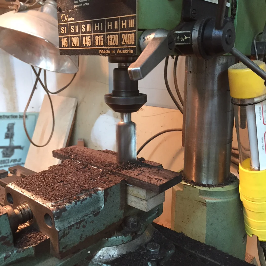 Surfacing the wood to achieve a flat surface and precise thickness.