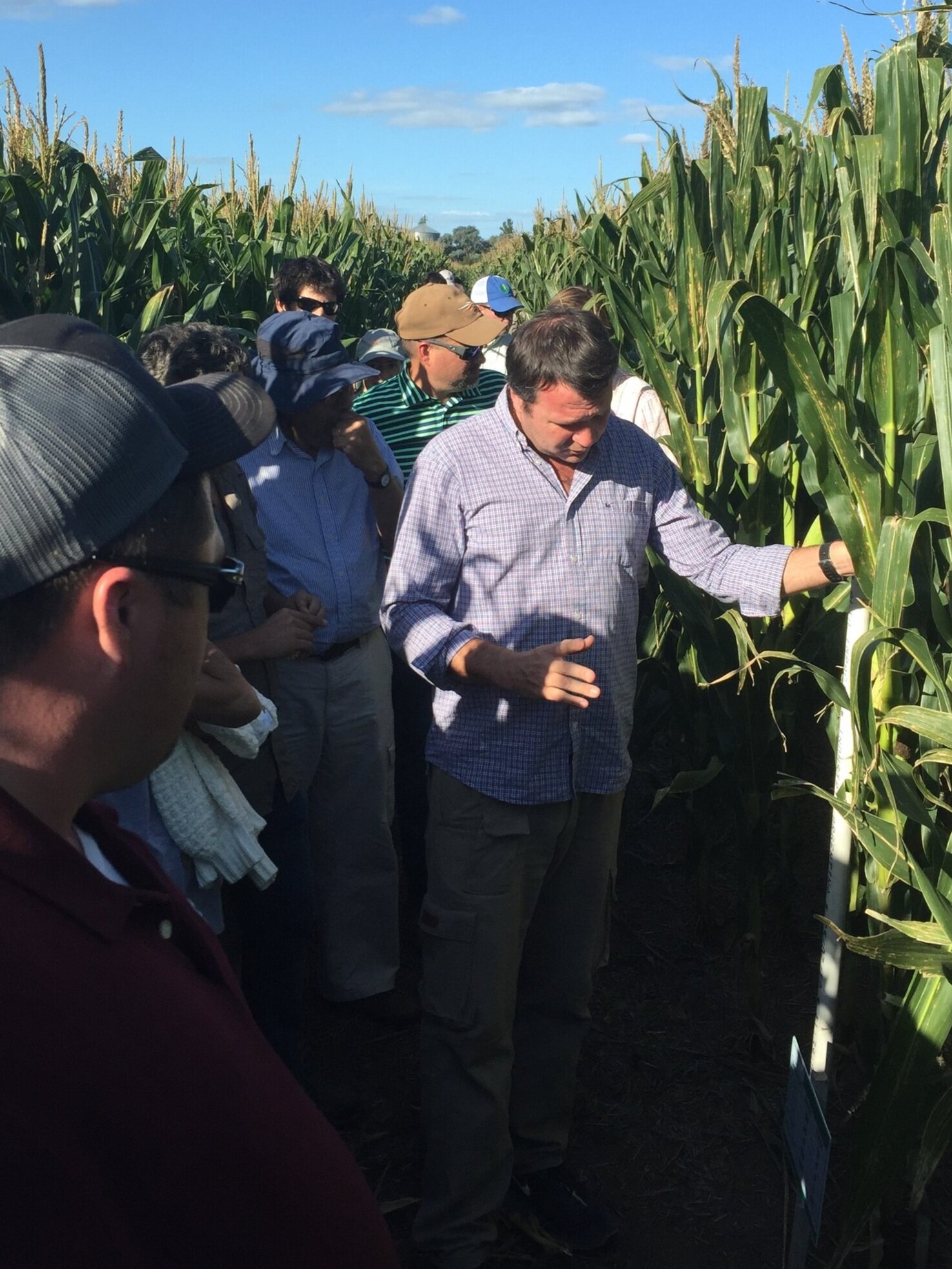 Joaquin Lagos walked with KyCorn CORE Farmer Program alumni through a test plot during a visit to his Argentina farm.