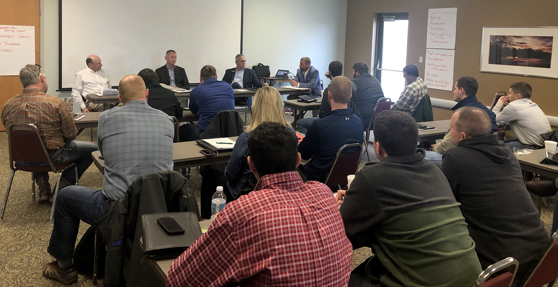 Clint Hardy moderates a panel discussion of ag lenders Wayne Mattingly, Brandon Garnett and Doug Lawson to provide banks’ perspectives and share advice with participants about credit strategies in a difficult grain farming economy.