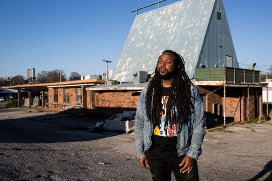 Artist, Jamond Bullock in front of old Whataburger in Frayser