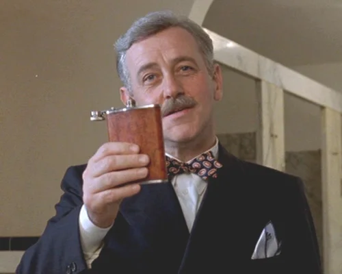 Mahoney as W.P. Mayhew in Barton Fink 's memorable introduction