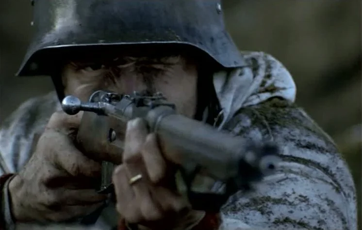 Martti (Taneli Mäkelä) aims his rifle during a Russian assault