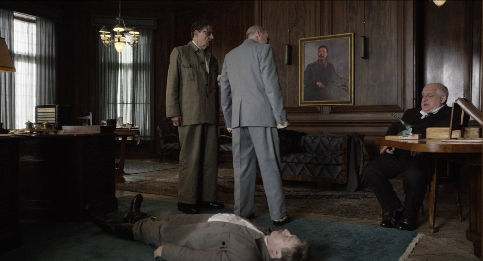 Adrian McLoughlin as Stalin, Jeffrey Tambor as Malenkov, Steve Buscemi as Khrushchev, and Simon Russell Beale as Beria in The Death of Stalin