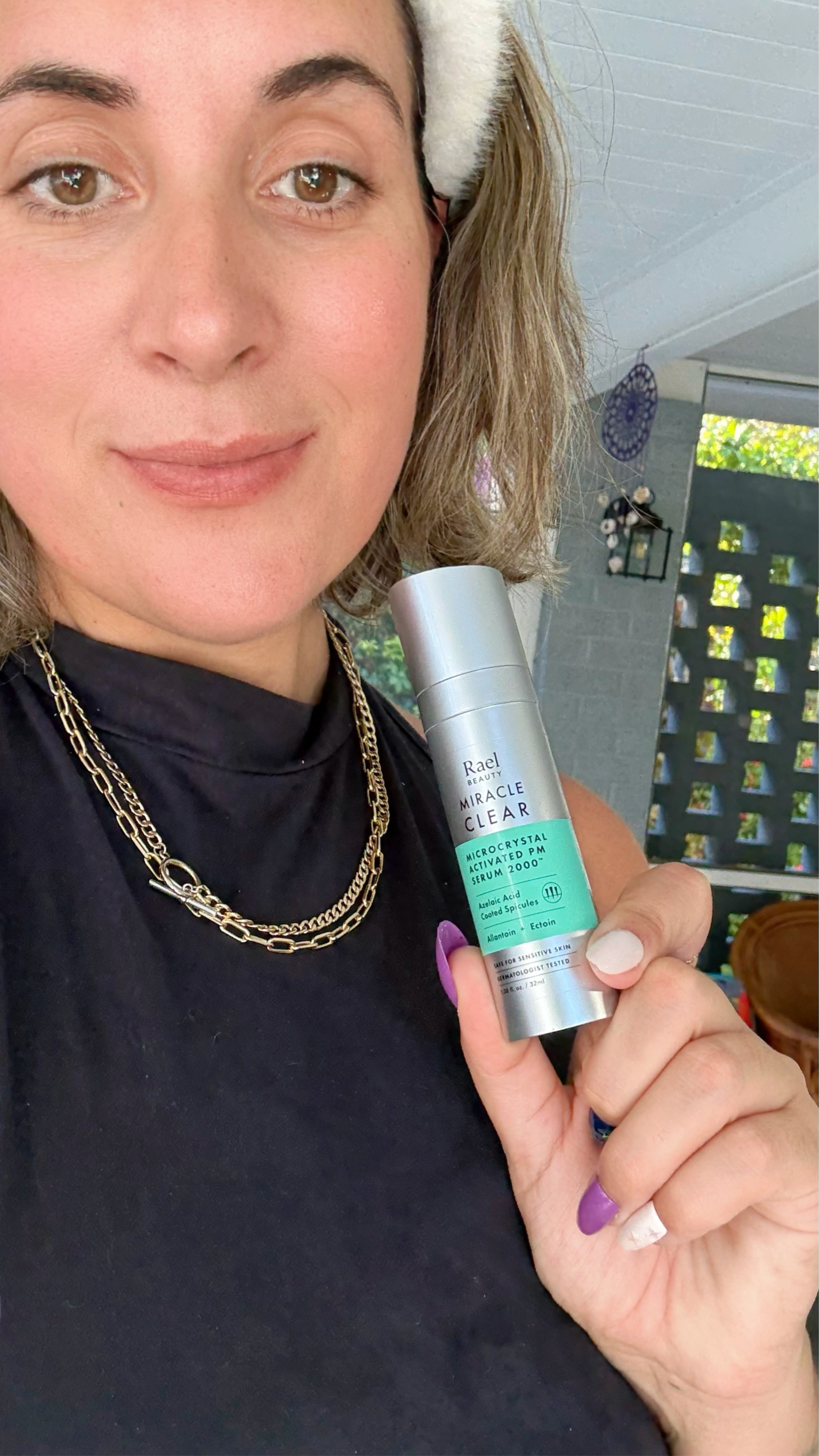 Rael Beauty Selfie With A Product.png