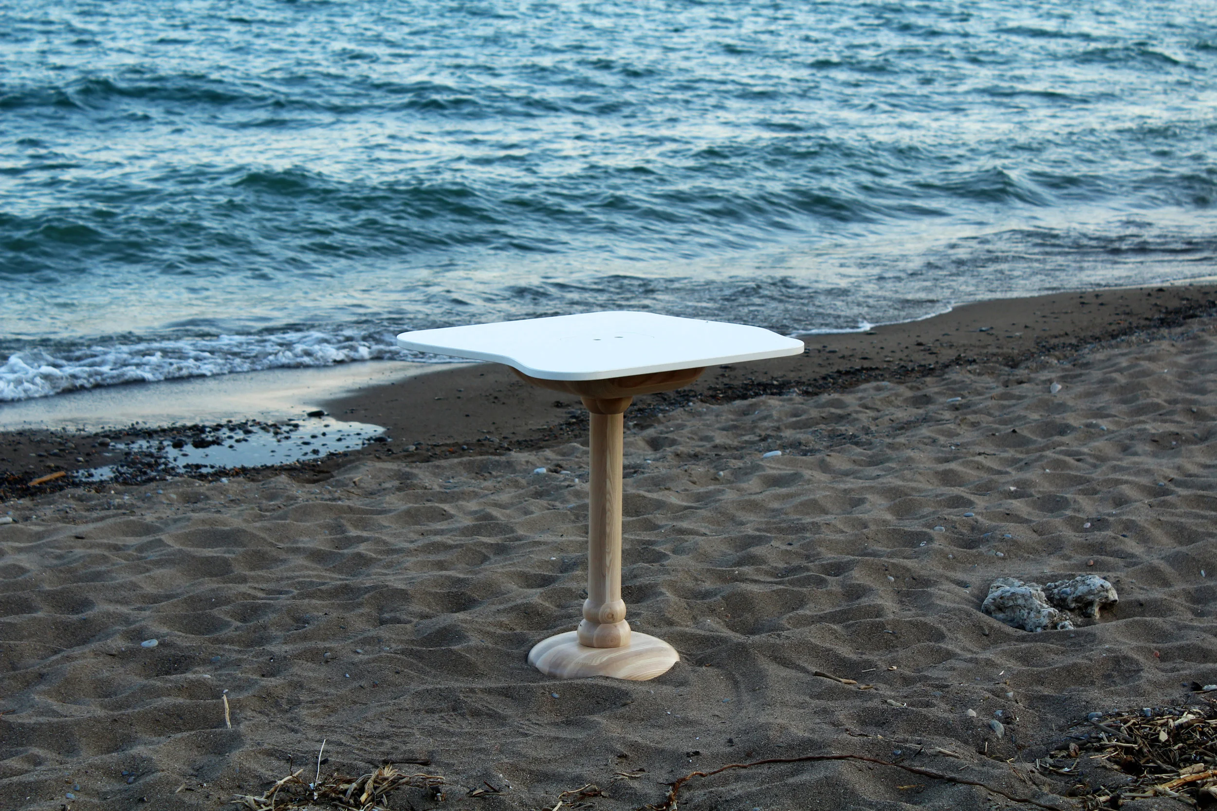 The Sea Table designed for Sara Restaurant, with a Caesarstone tabletop and solid ash pedestal