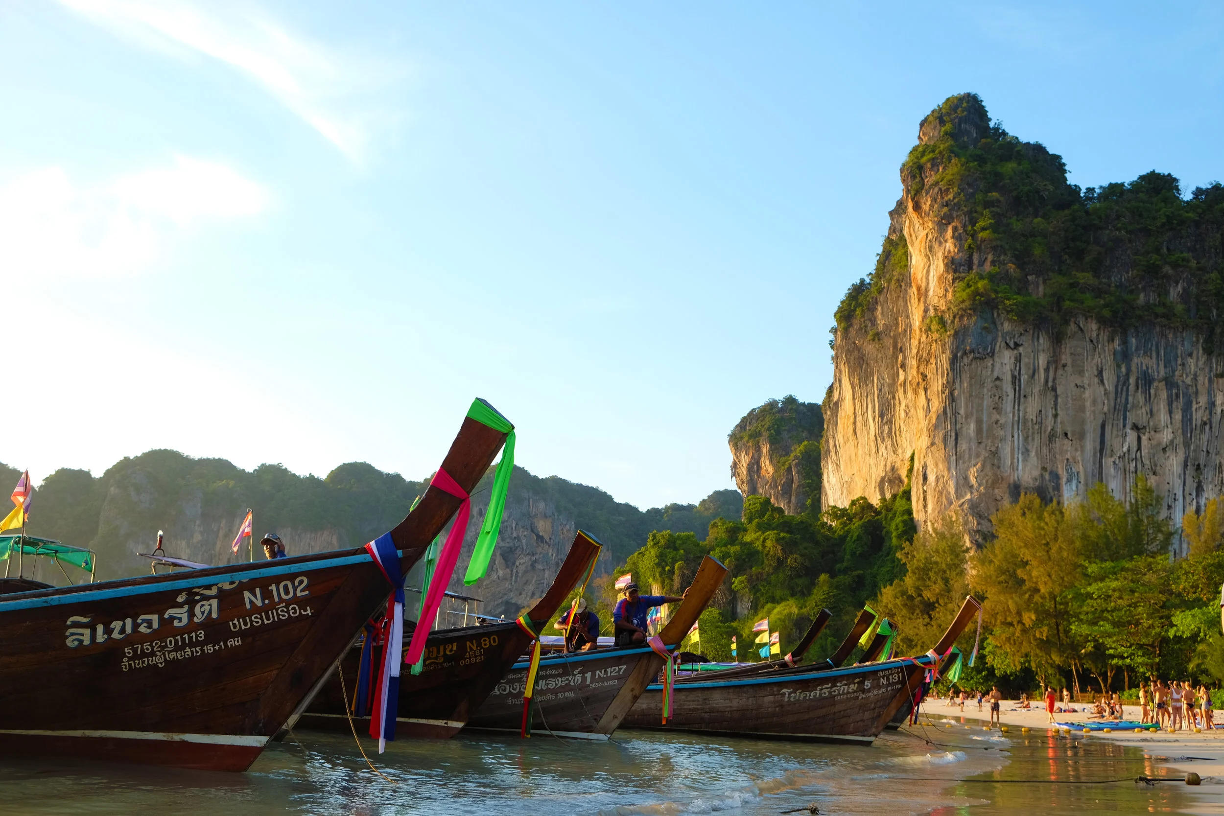 Long-tail boats at sunset