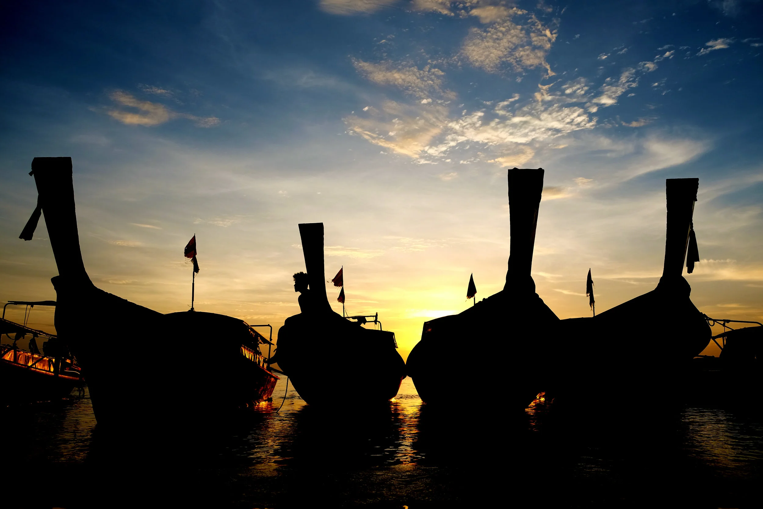 Long-tail boats at sunset