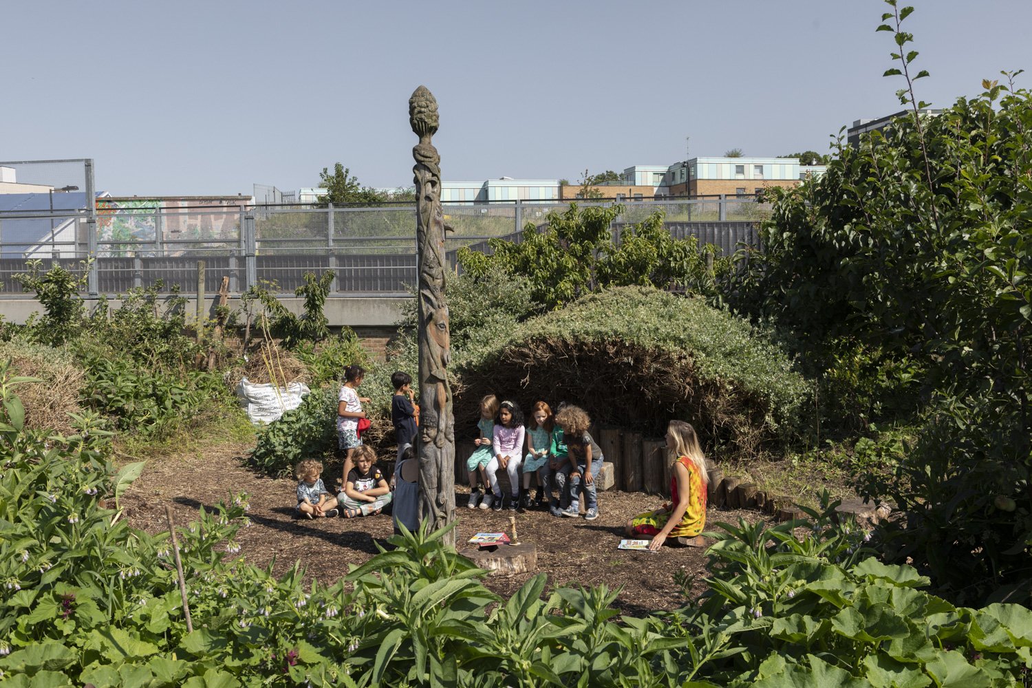 Gathering around the totempole.jpg