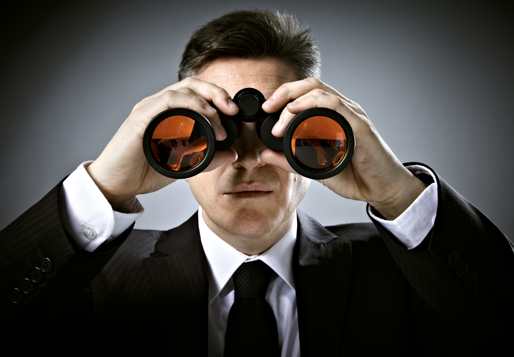 man-in-suit-with-binoculars.jpg