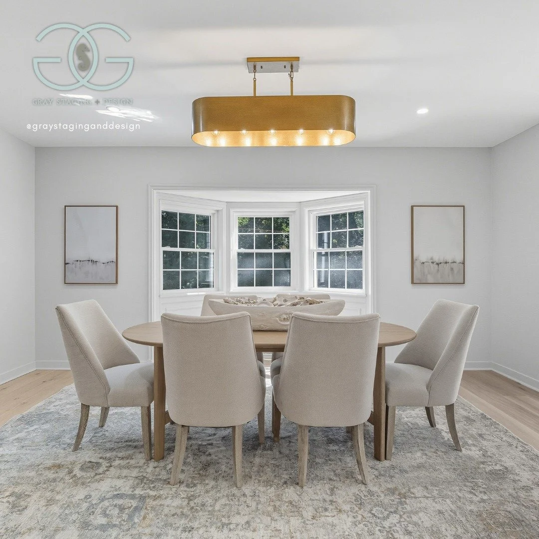 This light-filled dining space was staged to feel both refined and welcoming, blending soft neutrals with timeless textures. The round table encourages connection, while the layered rug and modern lighting add warmth and balance to the clean, bright 