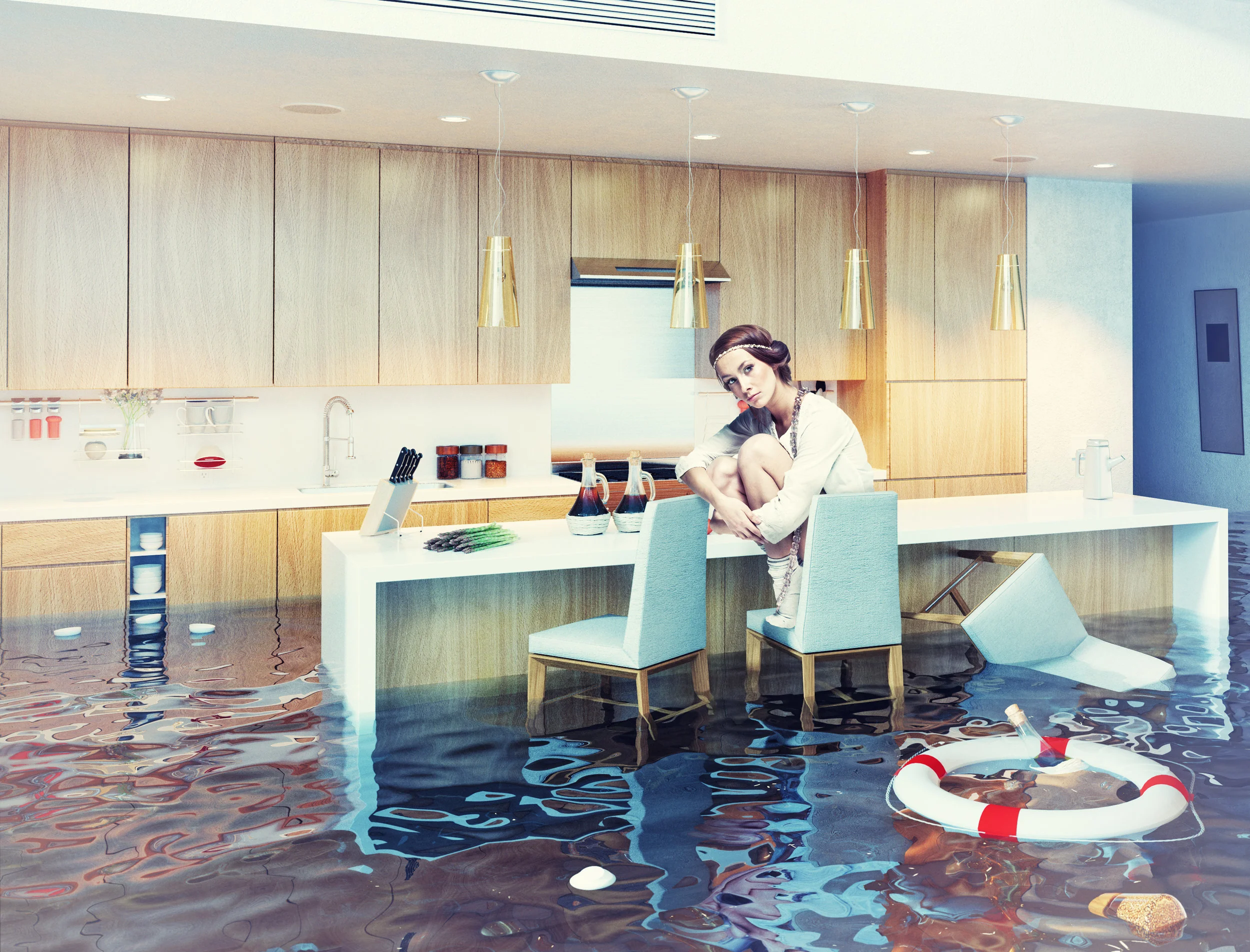 beautiful woman sitting on a chair in flooded kitchen interior. 