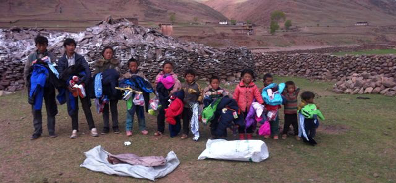 Children in a Martsang Kagyu international supported warm winter clothes