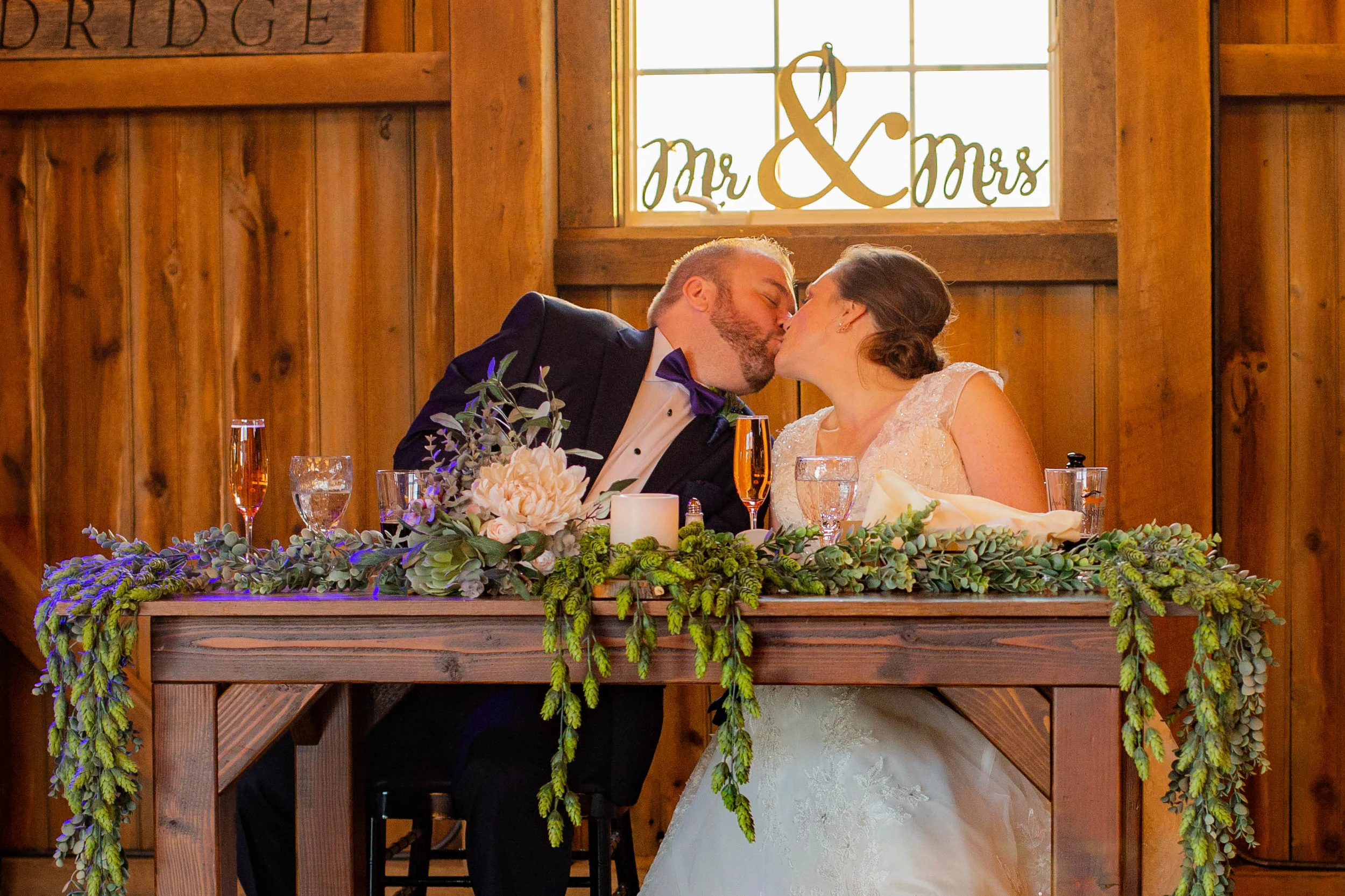 Bride and groom reception kiss