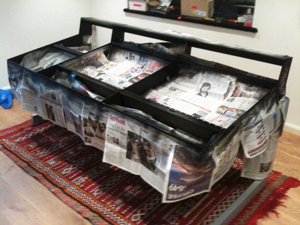 Trident desk frame masked off with newspaper during repainting