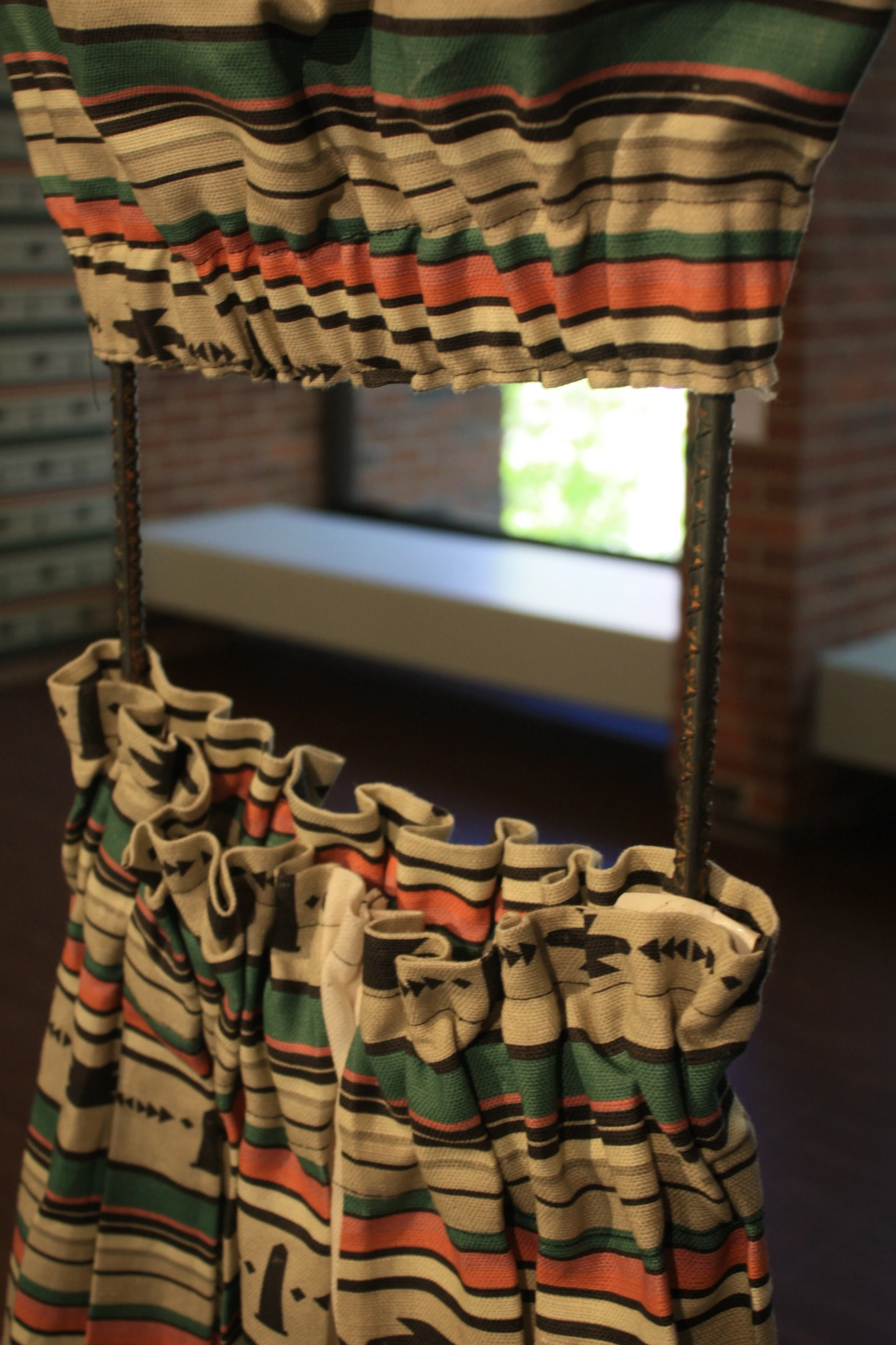  The dress is displayed in a rebar structure, one of the materials that, mixed with concrete,  strengthens new segments of the border wall.  