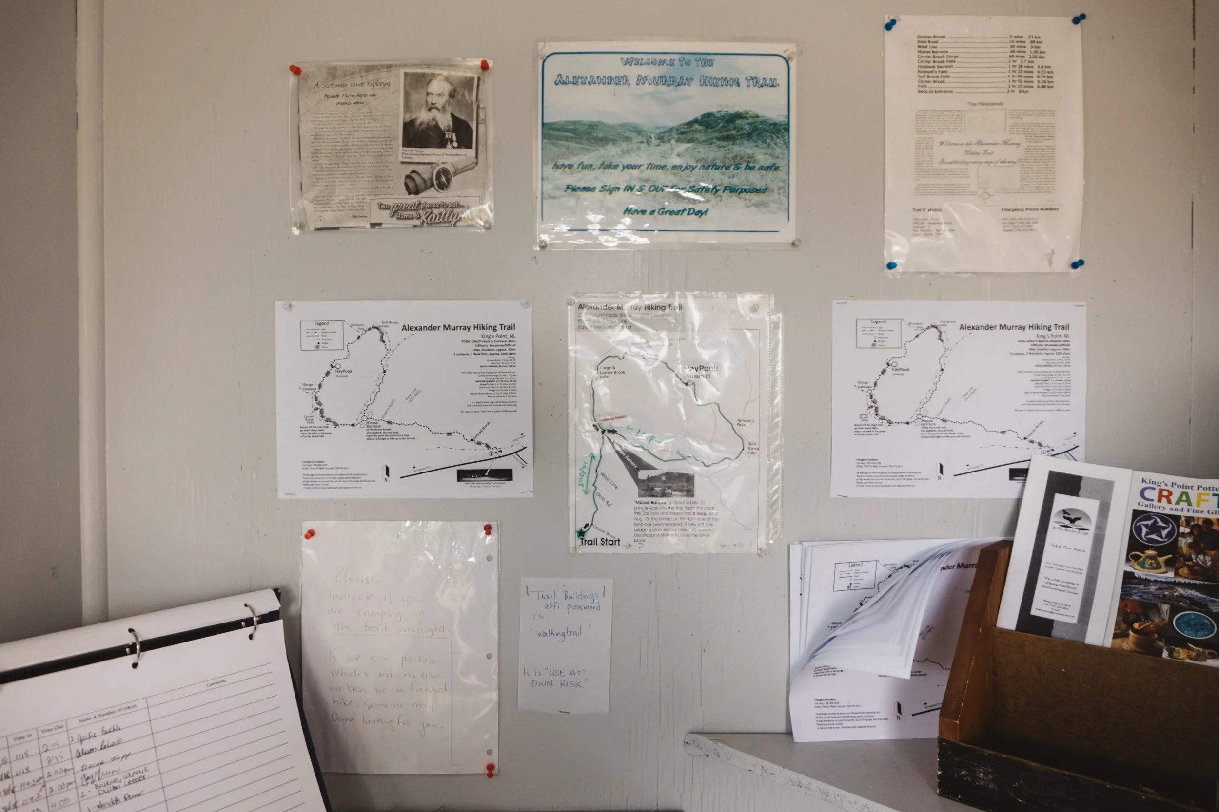 The guestbook and various, handmade signs leading up to the trail.