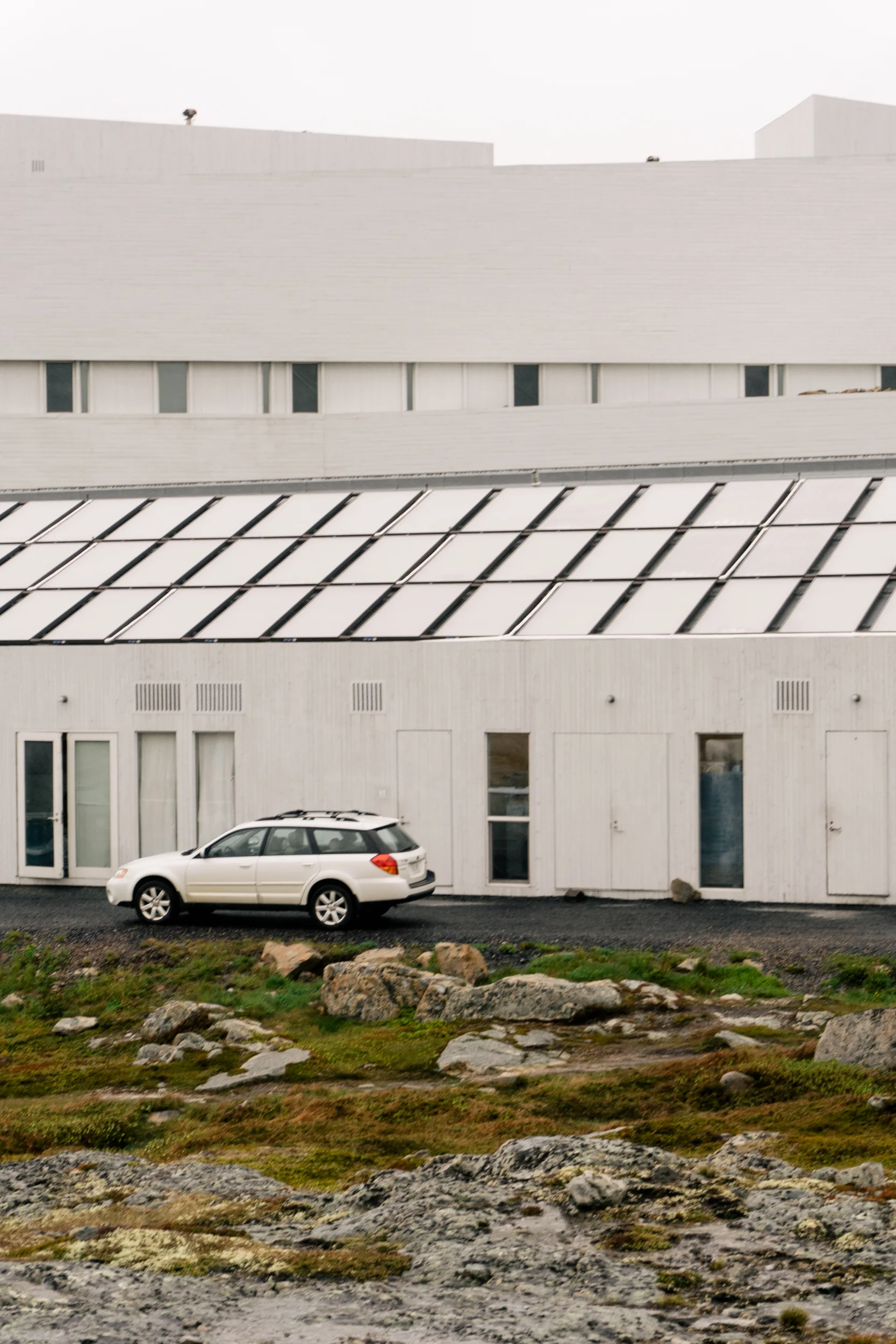 Solar-thermal panels stylishly cover the entirety of one of the buildings.