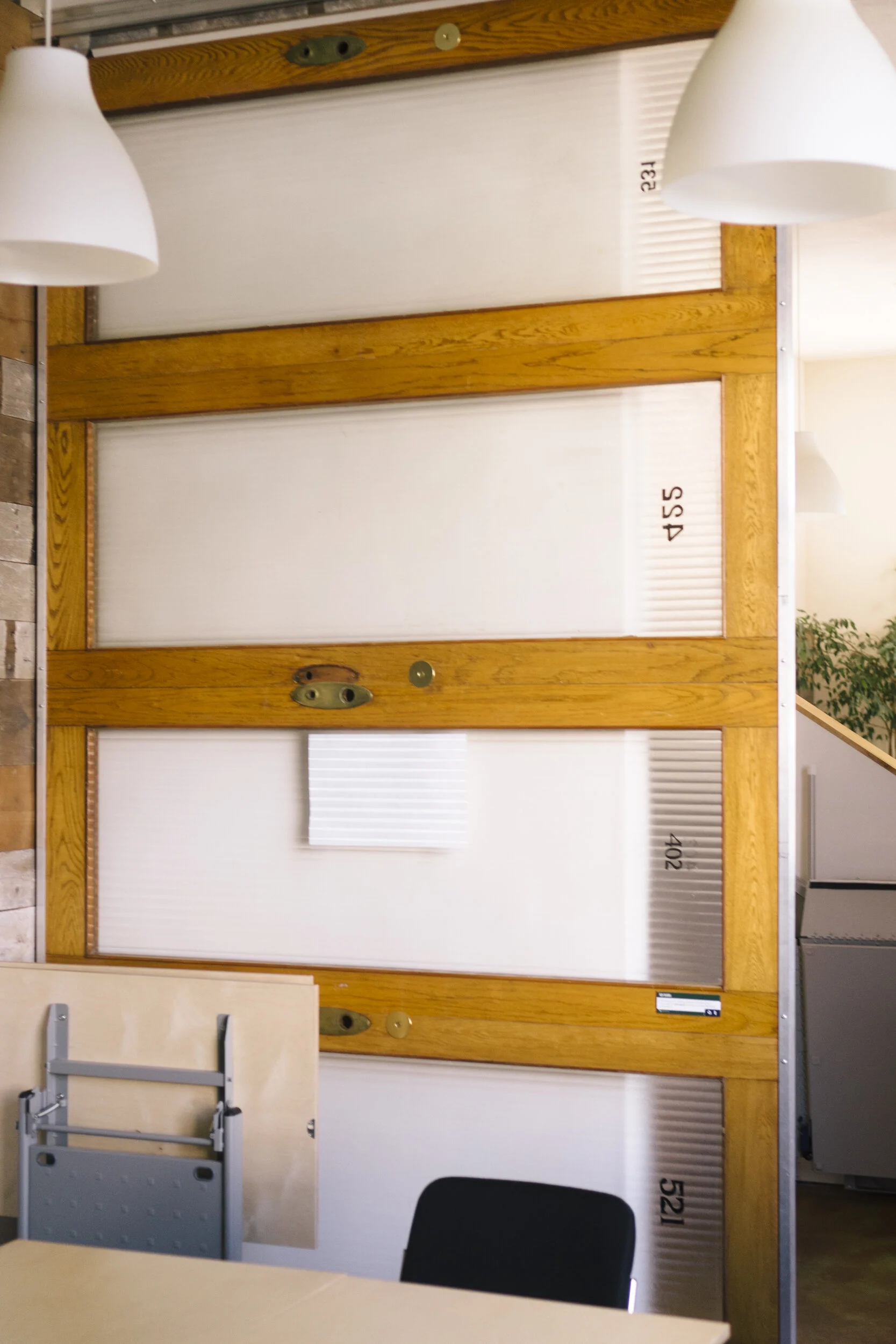 The beautiful, custom-made sliding doors on the EcoDanceHall are made from doors salvaged from the Roy Building. There are five other Roy Building doors throughout the building.