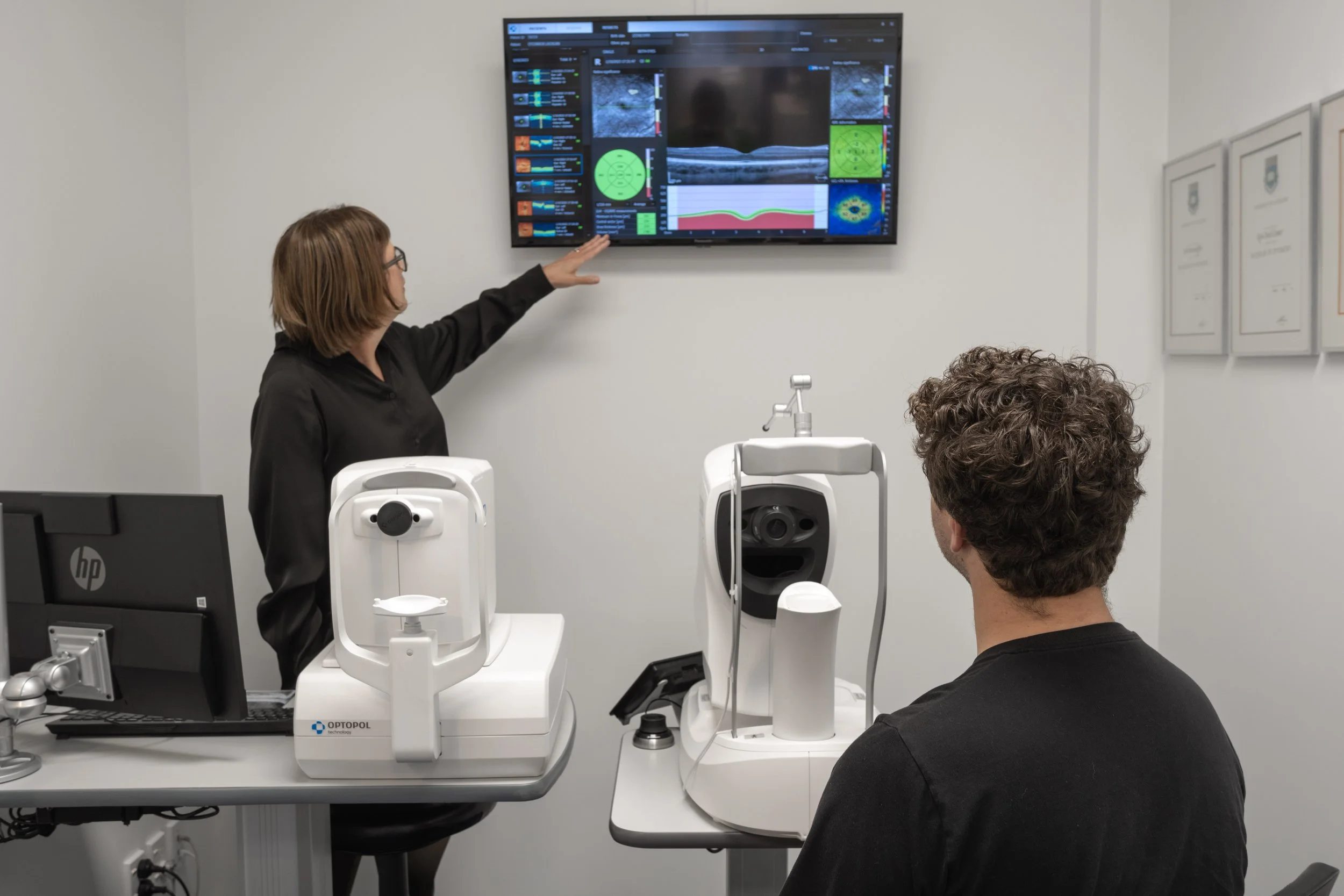Optometrist explaining eye health scans