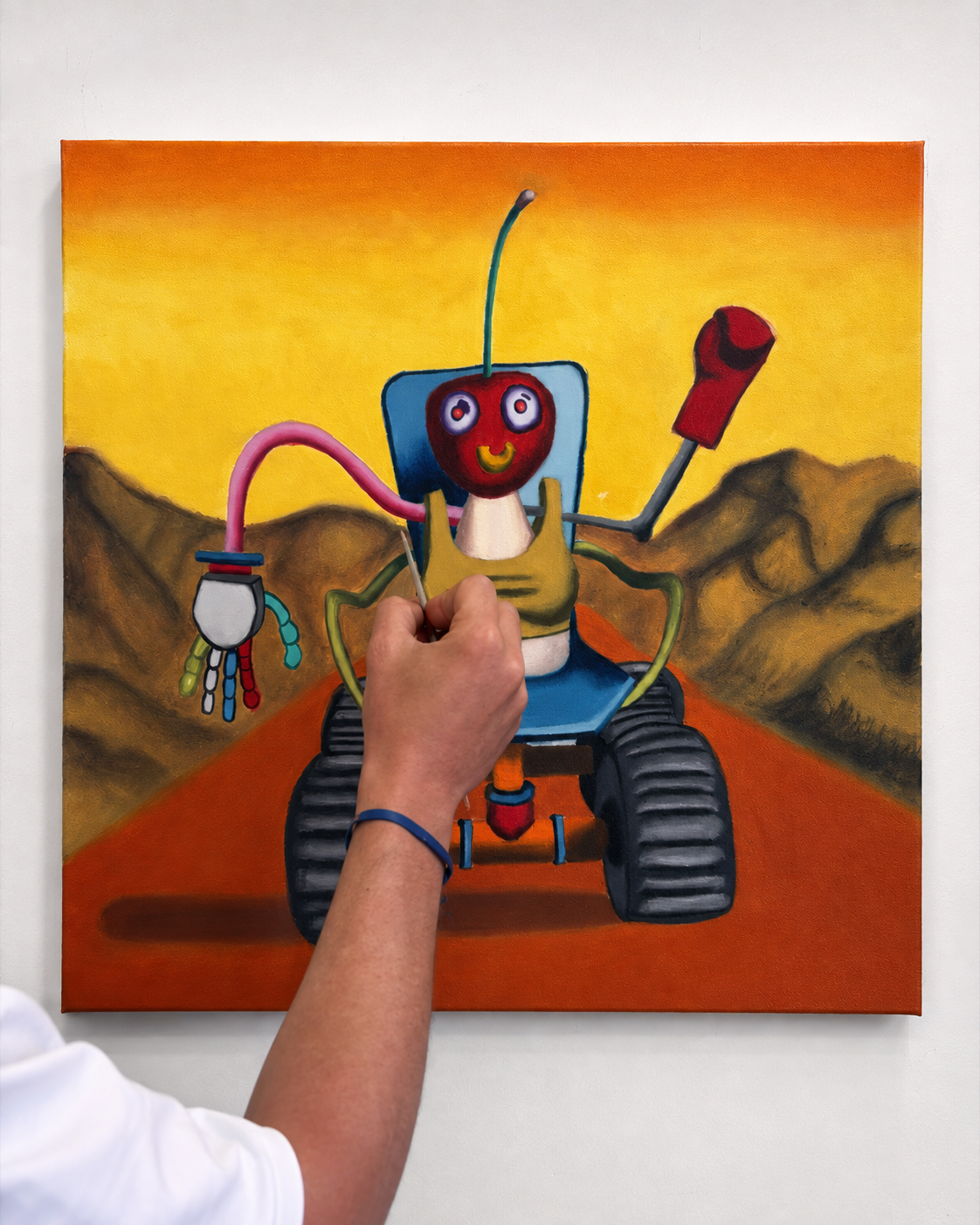 Alexander Reagan painting a colorful character artwork on canvas