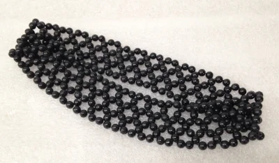 Record Number: 051 Collection Date: 20 Nov 2017 Description: Headband, black beads, used to hold hair back Dimension: .5" x 8" x 1.5"