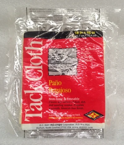 Record Number: 067 Collection Date: 21 Oct 2017 Description: Tack cloth, used to clean sanding residue, red packaging, tacky cheese cloth Dimension: 7" x 6" x 1/8"