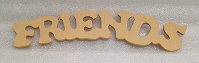 Record Number: 094 Collection Date: 30 Nov 2017 Description: "Friends" wooden decoration Dimension: 2.25" x 9" x 1/8"