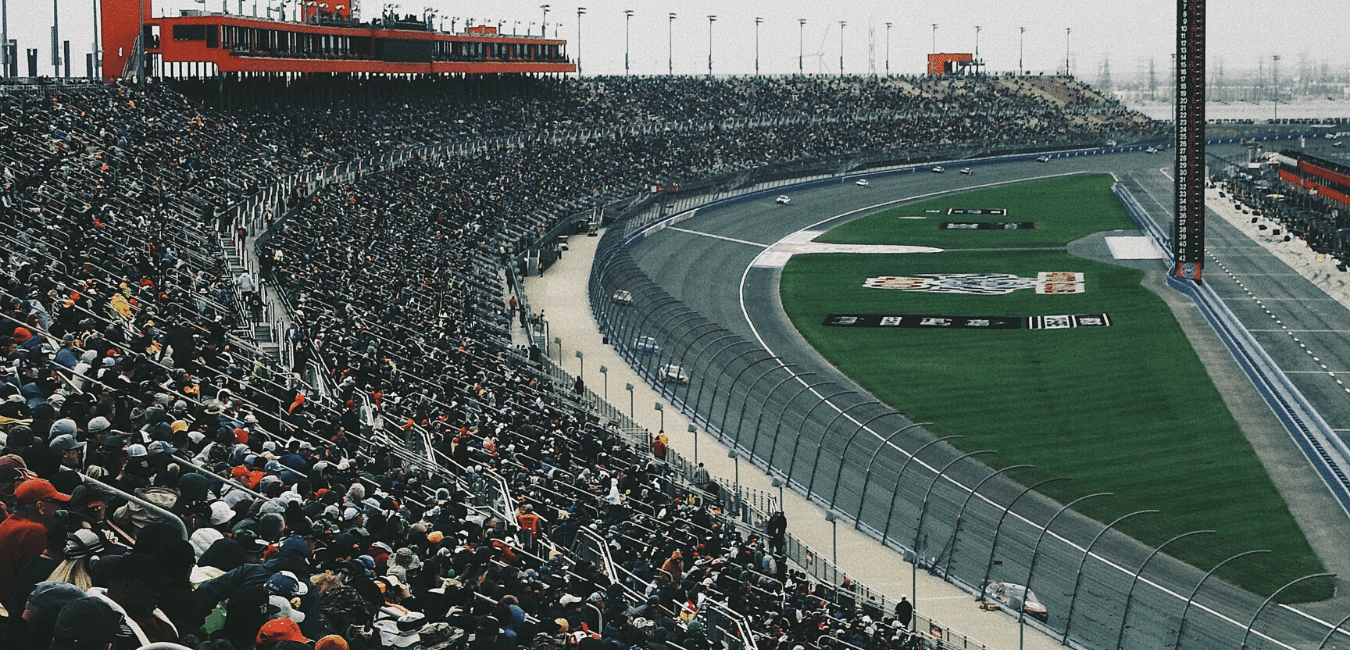 Concert crowd at outdoor music festival at sunset.png