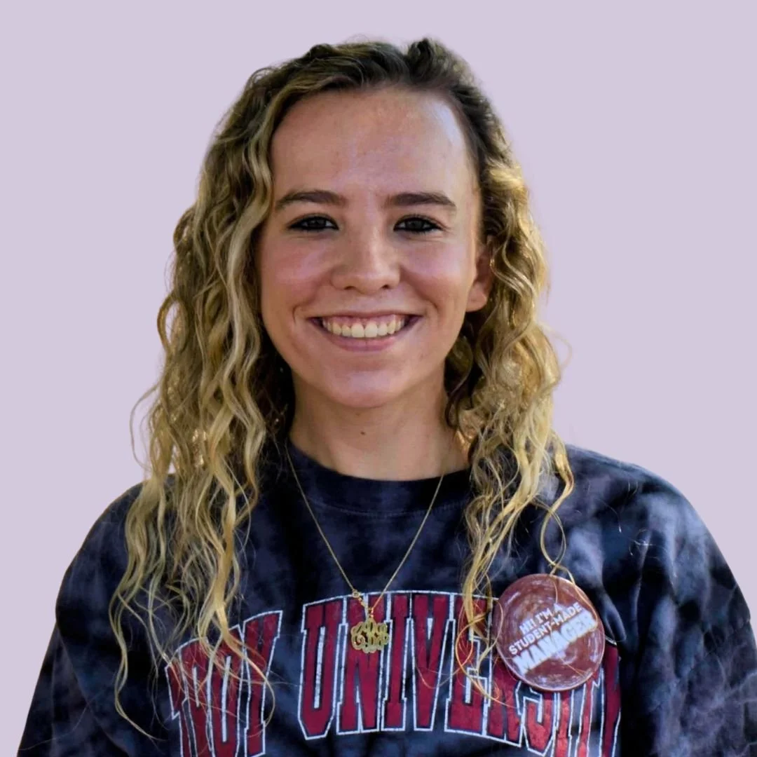 Smiling intern at Bauer Entertainment Marketing, representing career growth opportunities in music and sports marketing internships