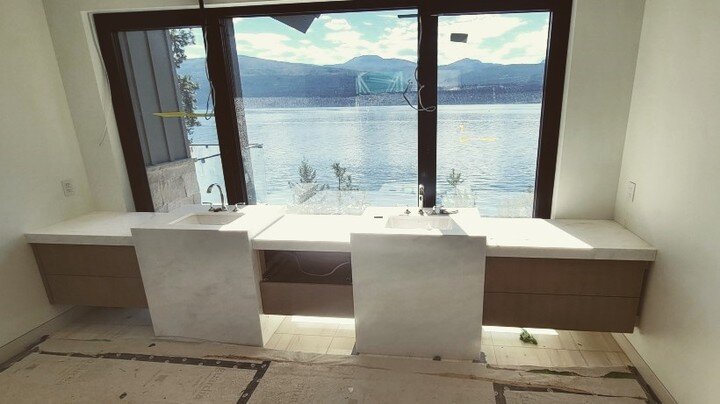 What a view!

This unique custom design features honed Bianco Rhino Marble quarried from Africa. The design includes mitered edges - meeting two unique custom cubed waterfall vanities - with all four sides showcasing the marble. A stunning feature fr