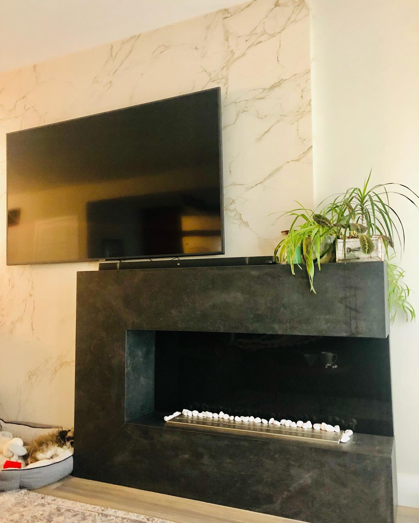 The feature of the living space - our custom designed open flame C shaped Dekton Fireplace - comes with a fluffy ball of fur to the left 🐶 
.
.
.
.
.
#revitastone #revitastonecountertopskelowna #kelownahomes #kelownabuild #kelownabuilders #kelownade