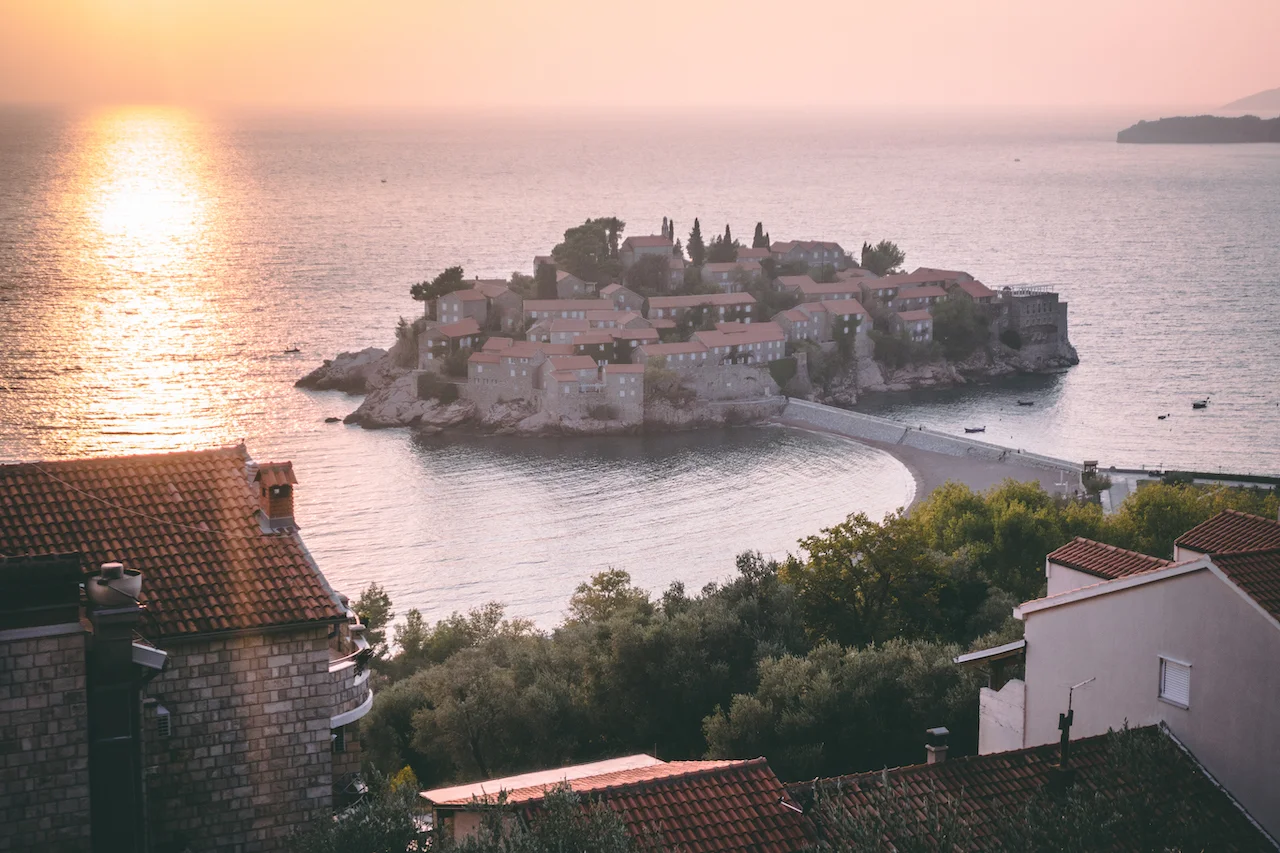 A small little island off the coast, sunset. It sure looks nice.