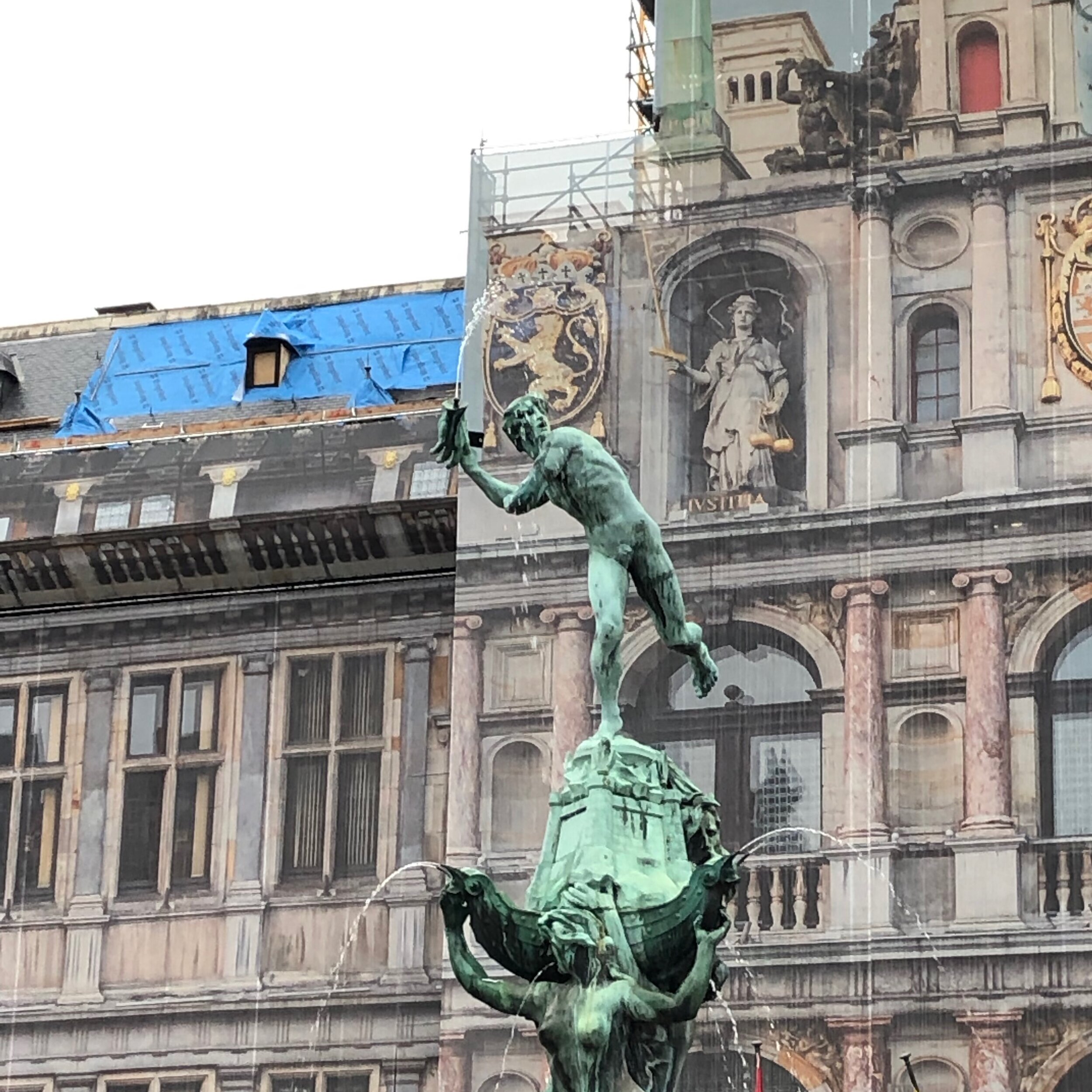 Antwerp City Hall with statues depicting the city's eponymous legend